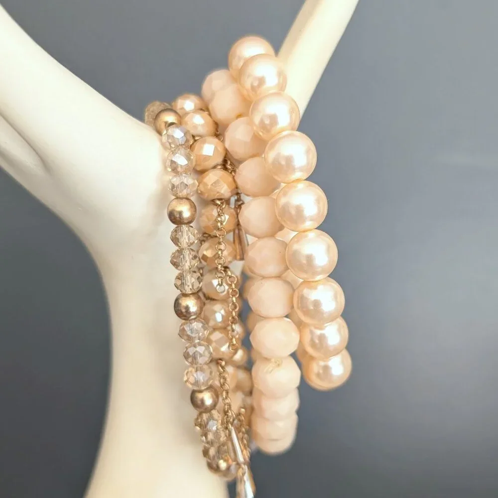 Bundle of nude and natural beaded stretch bracelets